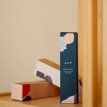 Load image into Gallery viewer, Blue skincare product box on a wooden shelf with a neutral background