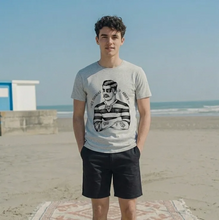 Load image into Gallery viewer, Grey t-shirt with a black and white graphic design of a person with a striped shirt and a crew cut haircut.