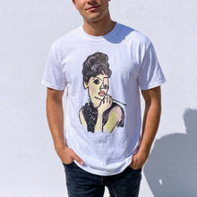 Load image into Gallery viewer, Person wearing a white t-shirt with a graphic design of a woman's face.