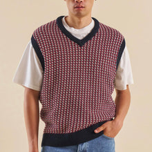 Load image into Gallery viewer, Person wearing a patterned sweater vest over a white t-shirt 