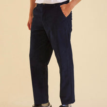 Load image into Gallery viewer, Men's fashion a pair of navy blue corduroy trousers with a straight leg fit and cropped leg design, displayed on a male model.