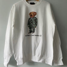 Load image into Gallery viewer, White sweatshirt with a bear graphic on a wooden hanger against a gray background
