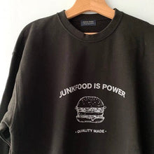 Load image into Gallery viewer, Black sweatshirt with "Junkfood is Power' words and burger graphic.