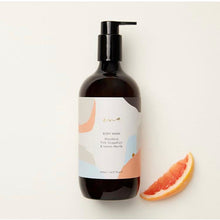 Load image into Gallery viewer, A pump bottle of Ena Products body wash with a label that reads 'Mandarin, Pink Grapefruit &amp; Lemon Myrtle'. The bottle is placed next to a slice of pink grapefruit.