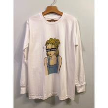 Load image into Gallery viewer, A white long-sleeve t-shirt with a graphic print of a character wearing sunglasses and a blue dress.