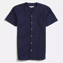 Load image into Gallery viewer, A navy blue, short-sleeved linen shirt with a V-neck, rounded pocket on the left breast, and wooden buttons.