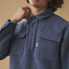 Load image into Gallery viewer, A male model wearing a navy blue heavyweight overshirt with a collared neckline and double pockets.