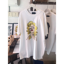 Load image into Gallery viewer, White crew neck t-shirt with a graphic print of a woman's face and hair styled in a bend.